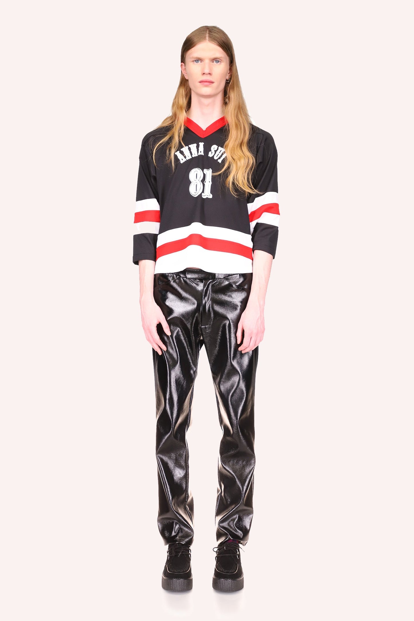 Jersey, red v-collar, black top with Anna Sui and 81 in white fonts, then stripes of white-red-white