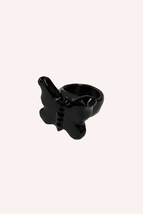 Doris Butterfly Ring, a dense and imposing black butterfly-shaped ring with a raised body in center,  