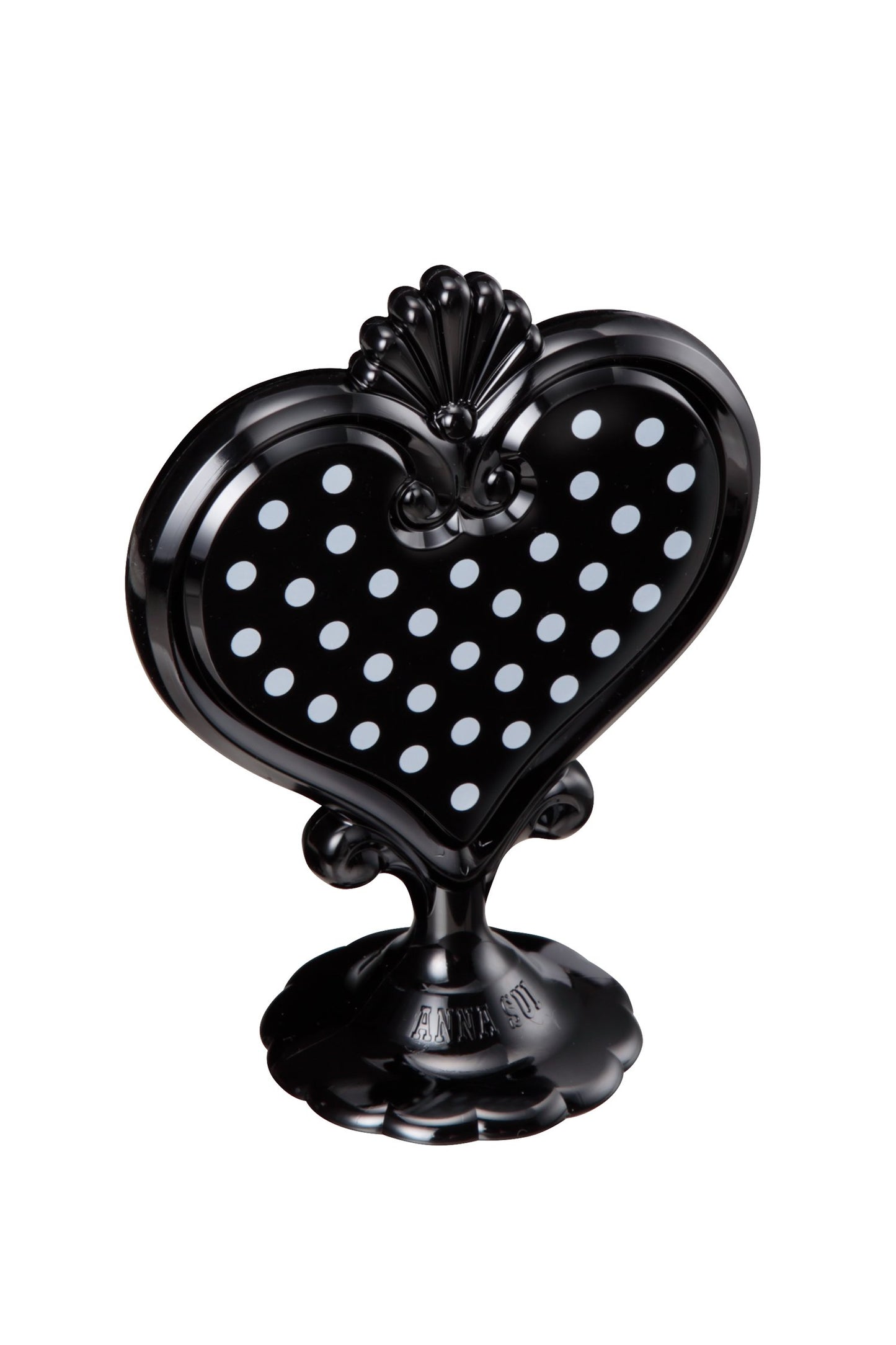 Black Stand Mirror in a heart-shaped with white dots in it on one side, stand with Anna label