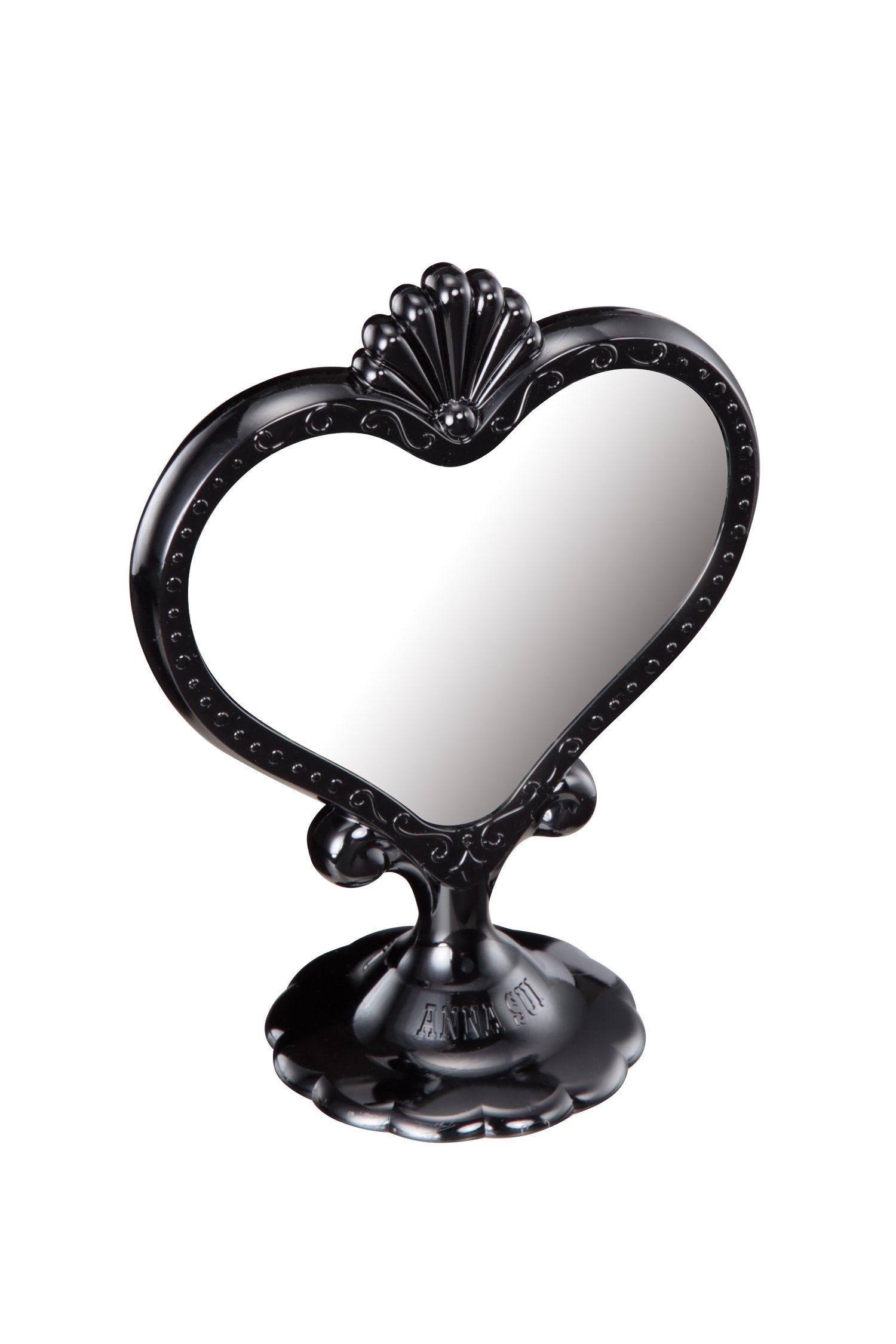 Black Stand Mirror in a heart-shaped mirror, a seashell on top on a stand with Anna branding