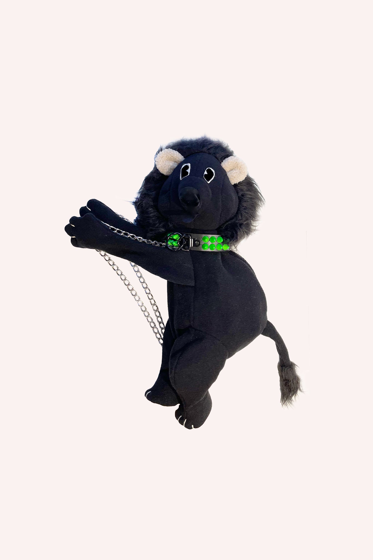 Fleece Lion Backpack Black, straps are a silver chain attach to a silver necklace with neon green buttons around the neck