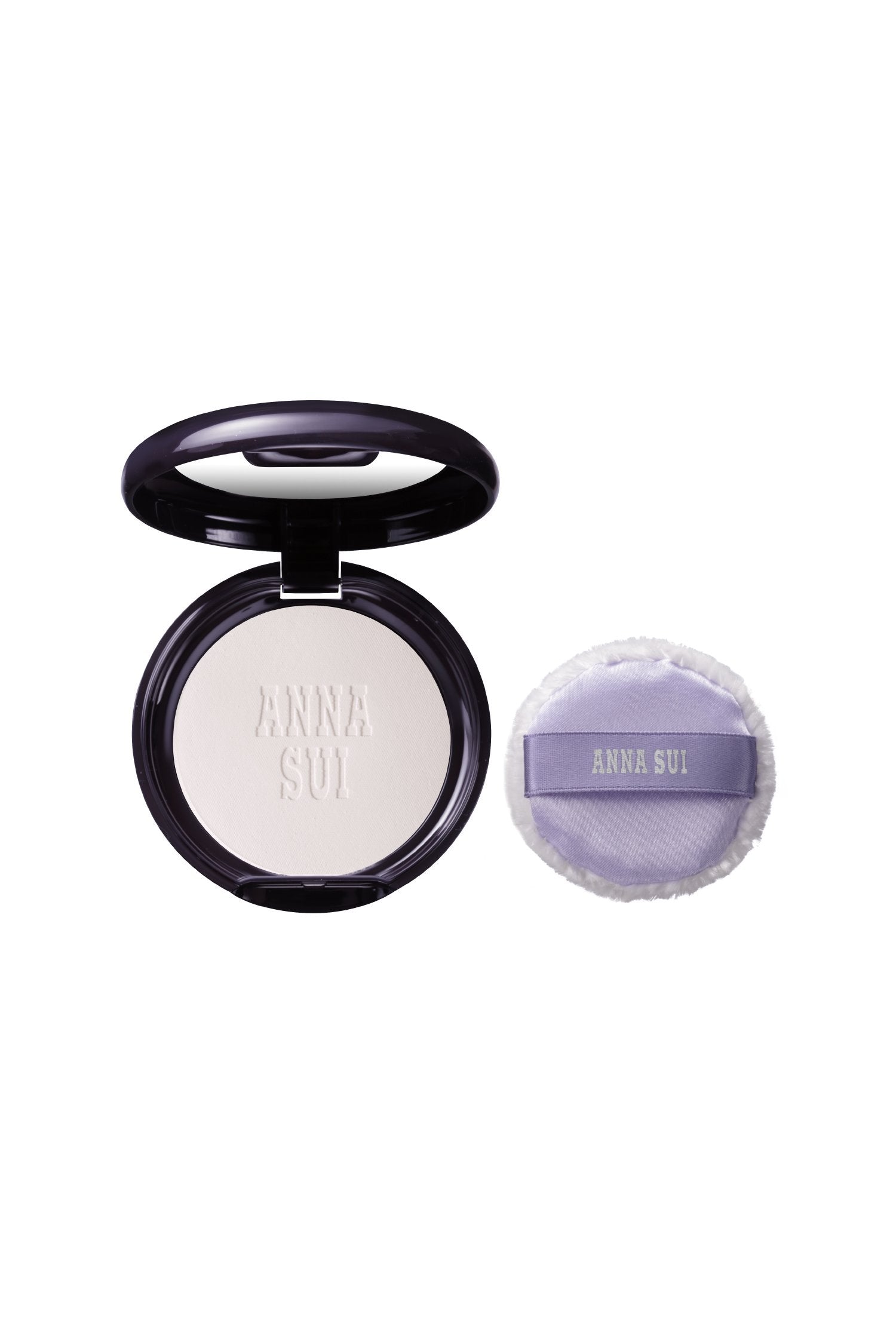 Open case of new skin-brightening powder, round, with a mirror, and a fluffy violet pad with Anna Sui label 