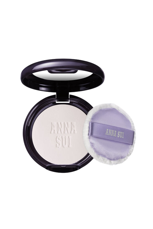 New skin-brightening powder, in a round case with a mirror, and a fluffy pad with Anna Sui label on pad and powder
