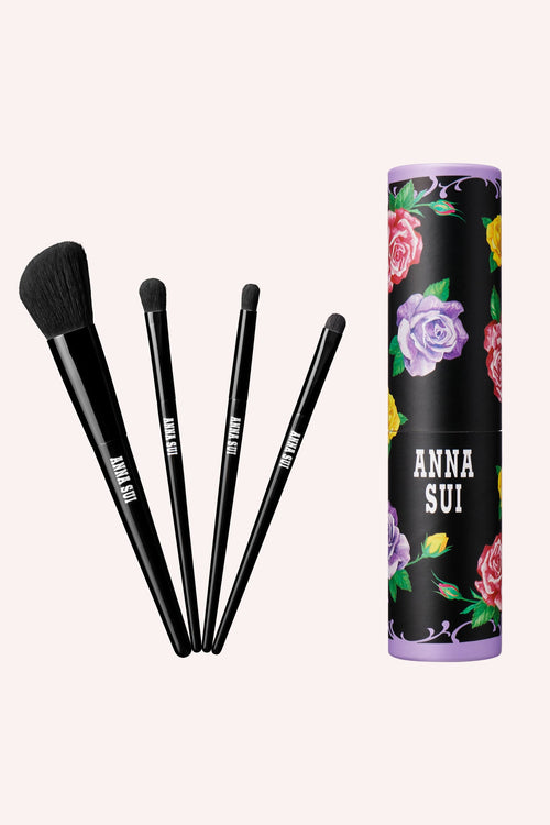 Brush set features 4 different brushes in a floral paper tube, Cheek/Highlighter Brush. Flat, round, and point brush for eyeshadow