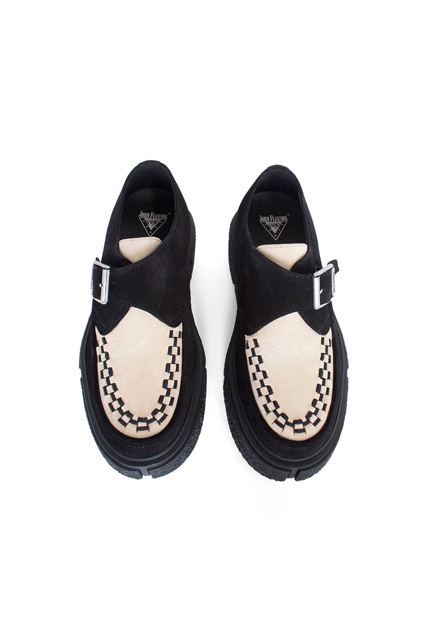 From the top, Creepers, the shoe are black, front beige with large hems, a buckle with label