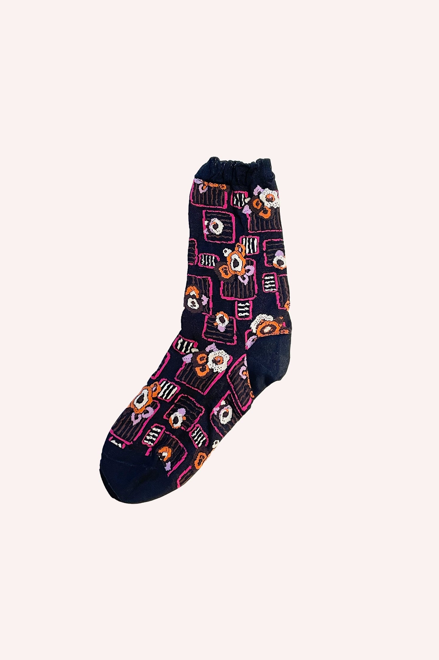Deco Floral Patch Socks on a black background, orange floral design in small square in pink