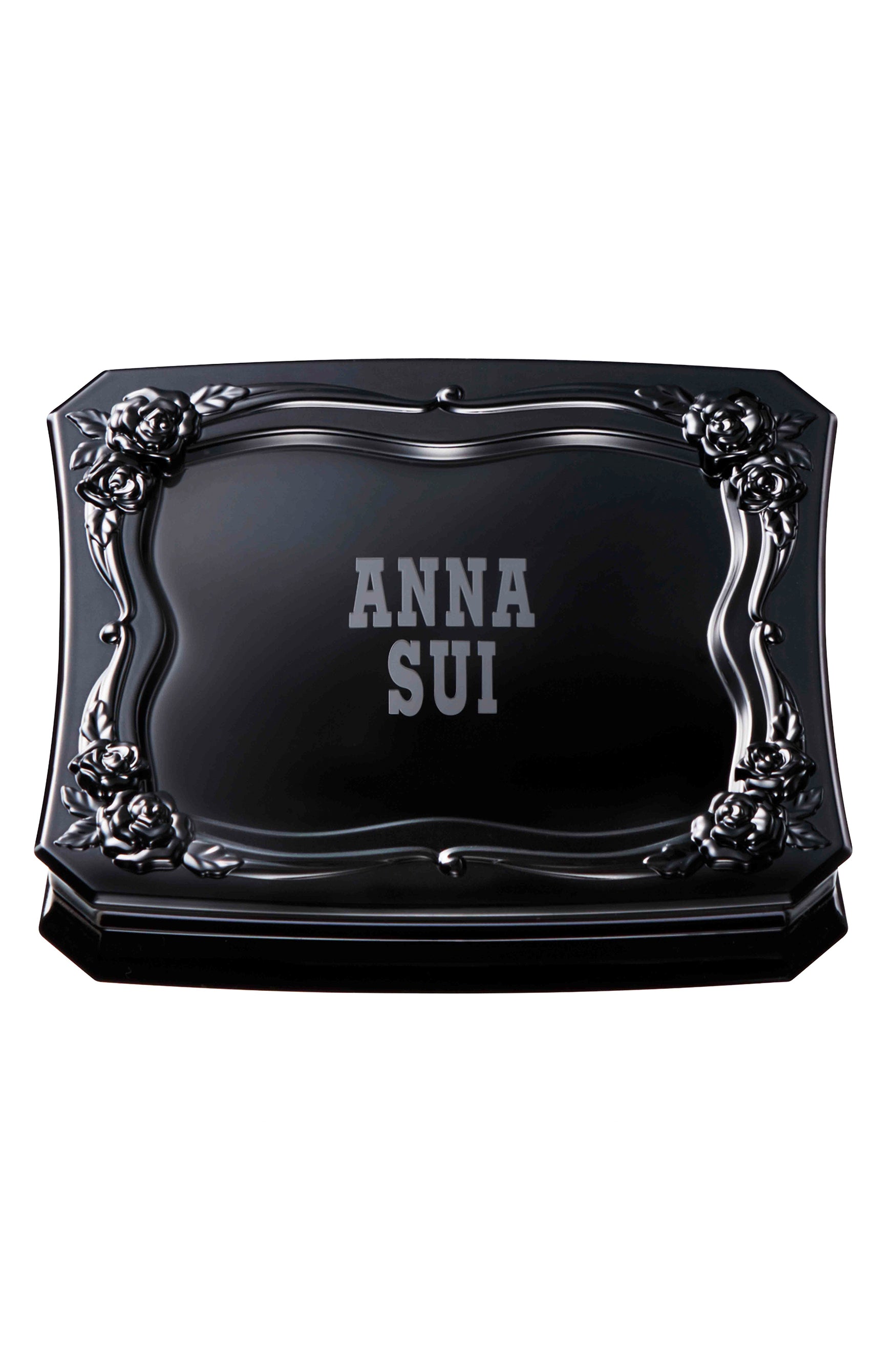 Eyebrow Compact black squared containers with curvy edges, a raised roses pattern on the edge of top lid, Anna Sui label in white