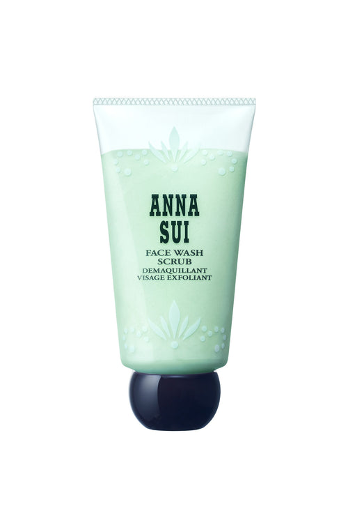 Face wash scrub is in a light green tube, a floral design and Anna branding, a black cap with flat face keep it uprigh