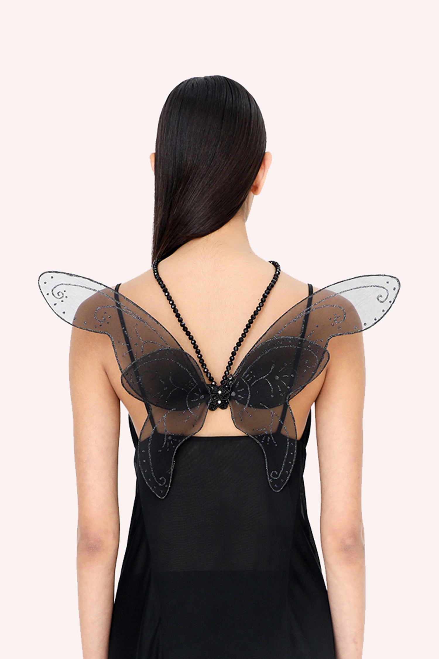 transparent black beads strap around neckline is fixed at the center butterfly body to wear the wings on the back 