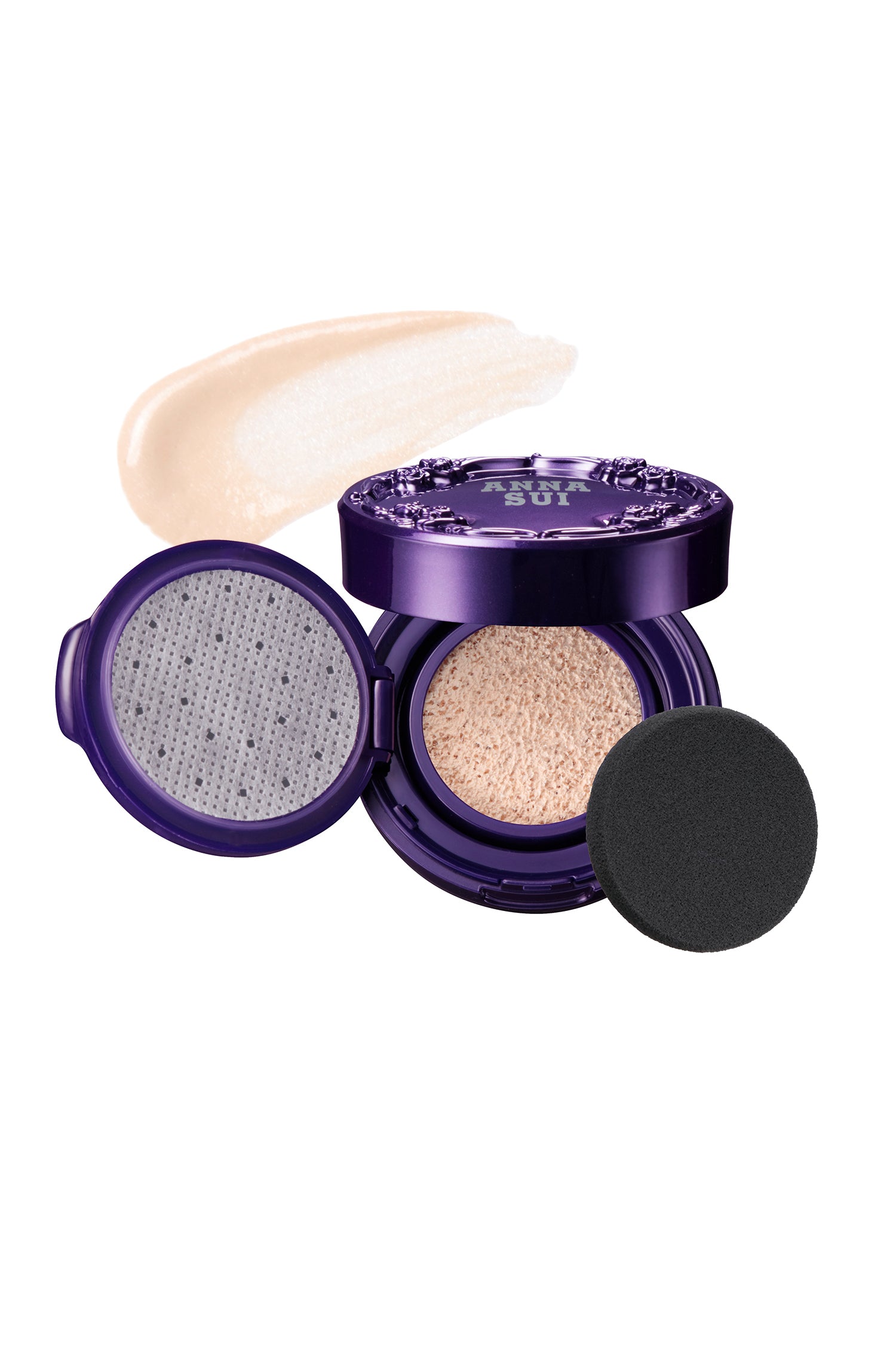 Purple round case, raised rose pattern and label, bottom, liquid face powder, on the left an open lid, black cushion