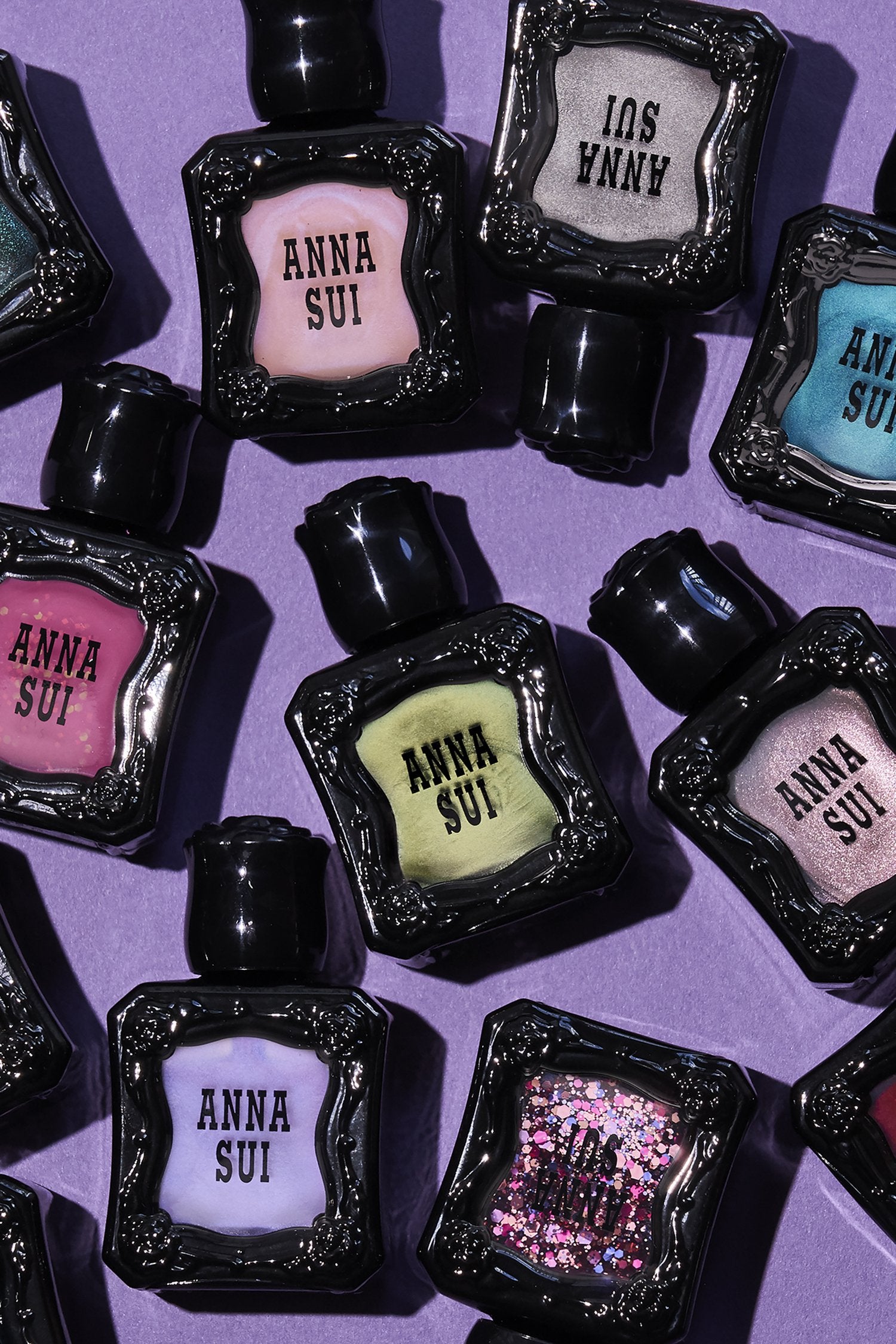 Nail Polish bottles, with raised rose pattern, Anna Sui in black over colors options in bottle side