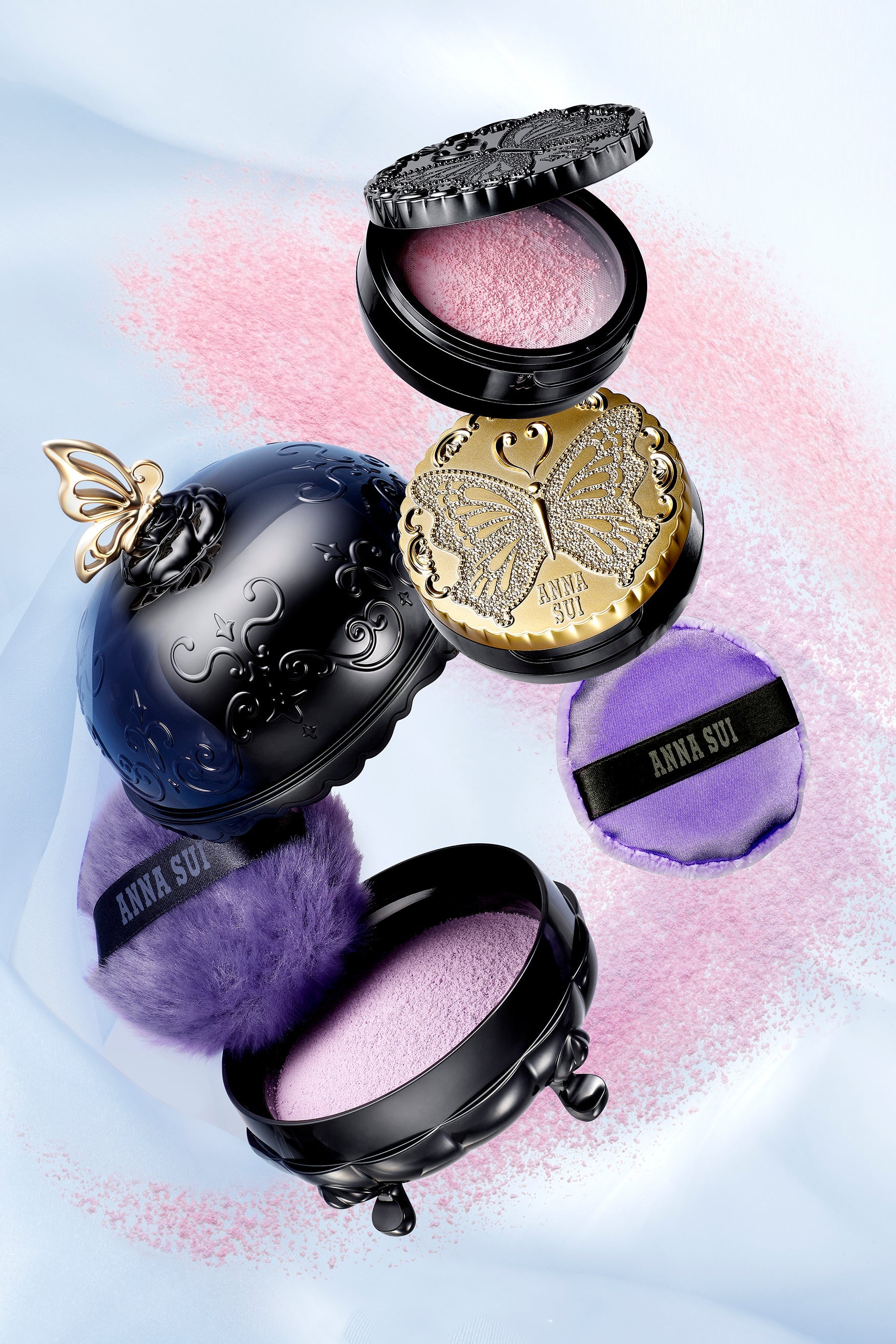 The round purple fluffy powder puff pair it with the Anna Sui Loose Powder for a flawless finish