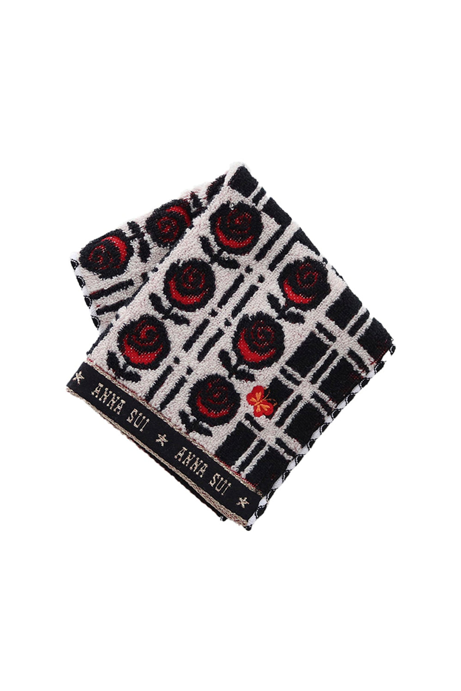 Washcloth, red roses on white, black border at bottom white Anna Sui's signature, res butterfly