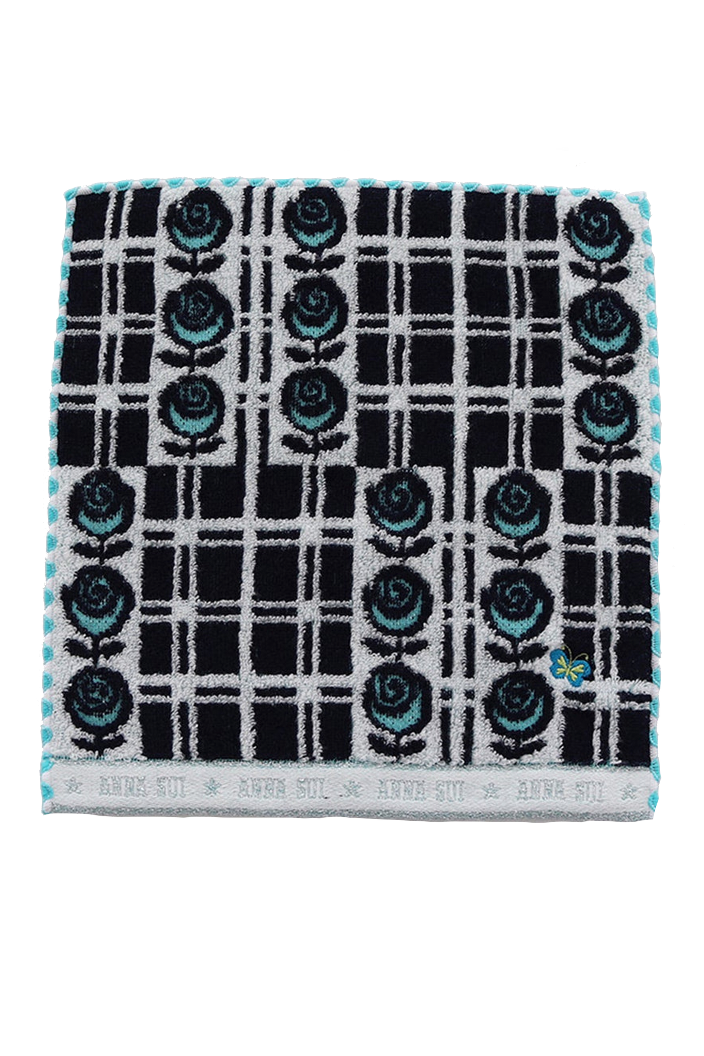 Washcloth, black with blue roses on white, white border at bottom with white Anna Sui's signature
