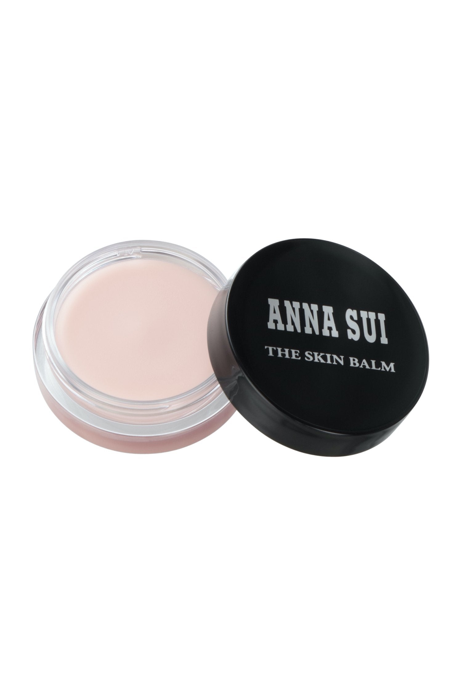 Round case transparent bottom, and black lid with Anna Sui in white and “The Skin Balm” in white