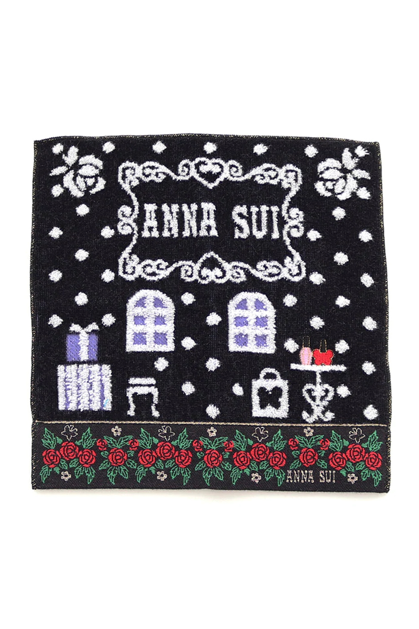 Washcloth, black, white shop design, Anna Sui label, presents, table, bottom with red roses line 