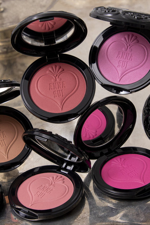 The 5 Sui Black - Powder Blush color, in open black rounded containers