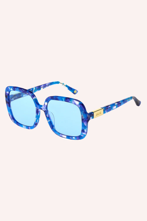 Square Sunglasses Turquoise, frames are in shade of blue, white spots, turquoise glasses, Anna Sui on the branches