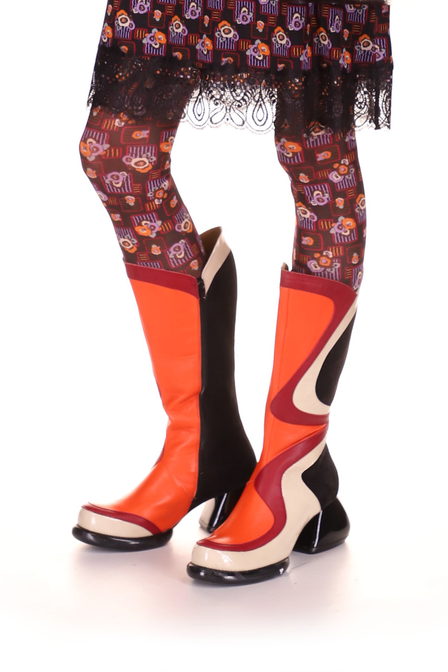 Psychedelic orange wavy design with red and white highlight, black in the back, sole, and heels